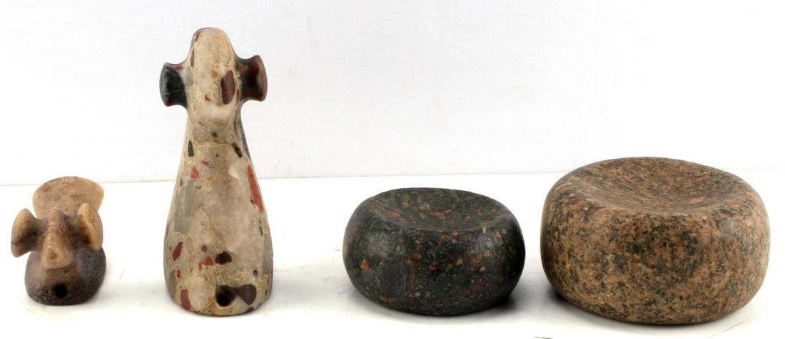LOT OF FOUR REPRODUCTION NATIVE STONE ARTIFACTS: Lot contains two stone discoidals. 1 measures 3.50 inches in diameter and 2 inches thick, the other is 4.50 inches in diameter and is 2.50 inches thick. 1 bird effigy popeye figure, measures 5.50 inch
