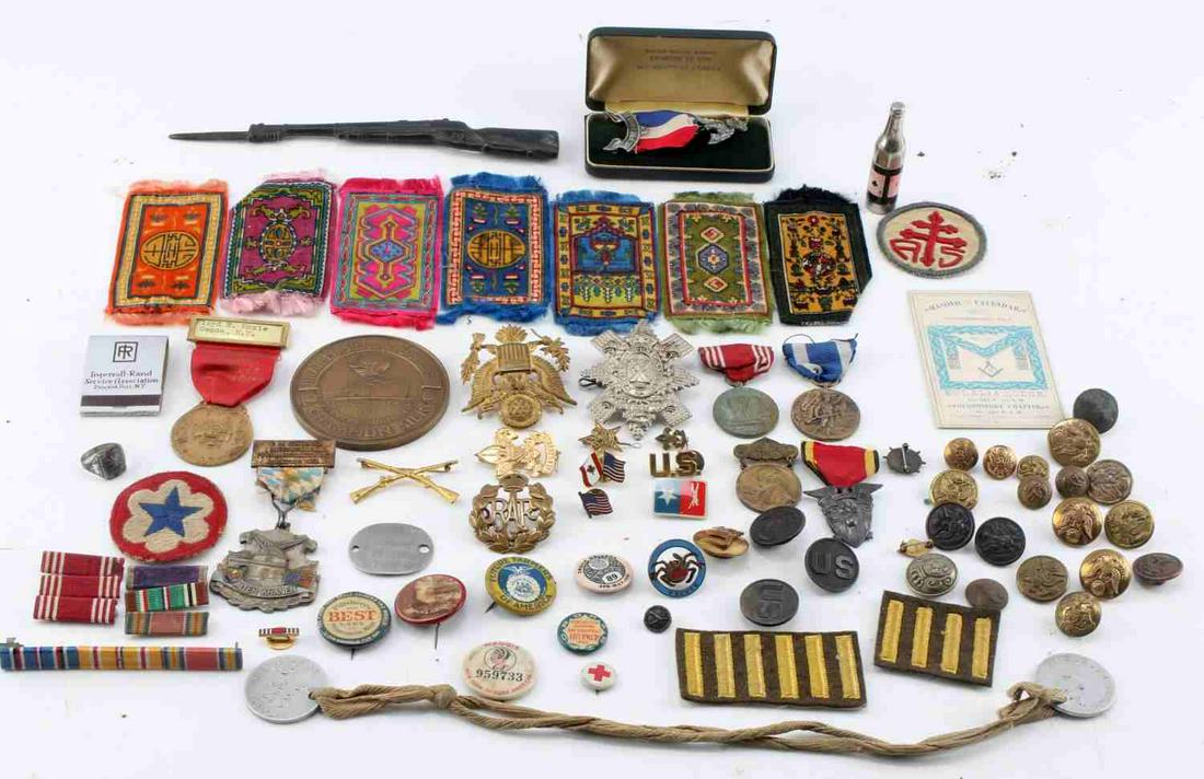 LARGE MIXED CONFLICT BADGE BAR AND MEDAL LOT: Large Mixed Conflict Badge Bar and Medal Lot. Includes badges from the USMC, RAF, US Army, Army Good Conduct medals, some patches, EGA buttons and Boy Scout awards. The lot also includes early 1990s T
