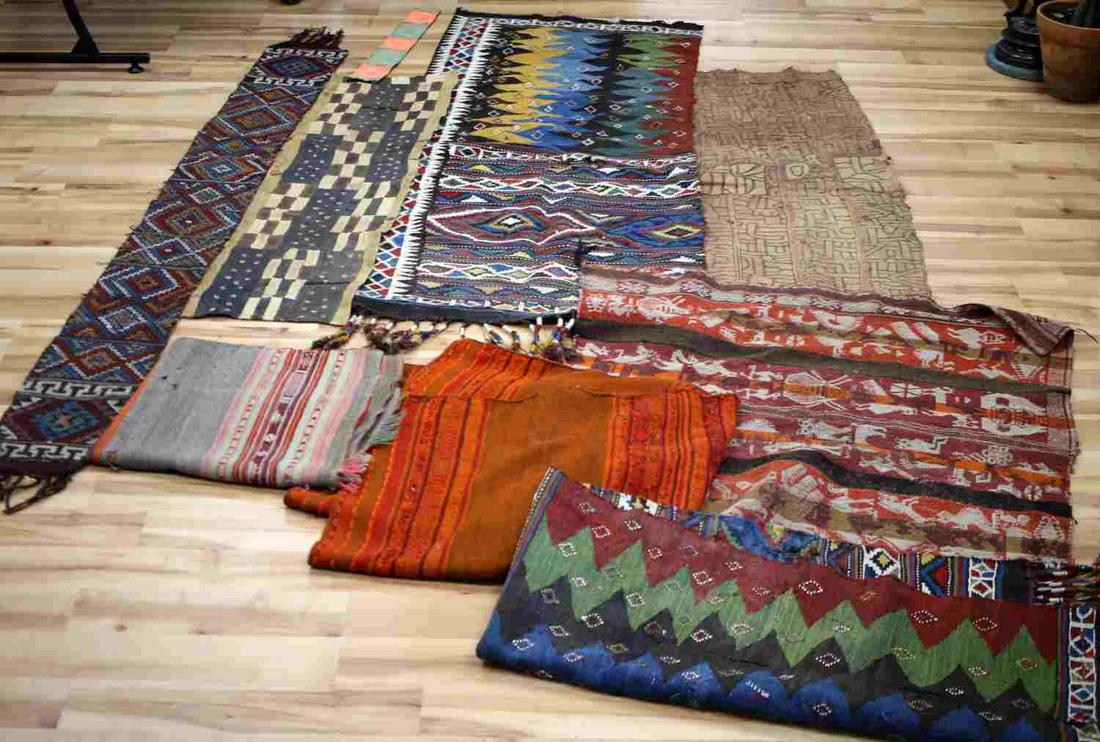 LOT OF TEXTILES CENTRAL SOUTH AMERICAN & MORE: 9 pieces total. A variety of colors, shapes, and sizes. Some with zoomorphic design, geometric shapes. The longest one measures 63.5 X 24.5 inches and has a matching piece. One small tablecloth measur