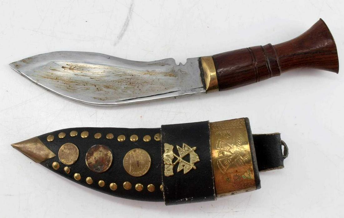 NEPALESE JAMBIYA DAGGER WITH ORNATE SHEATH: Nepalese Jambiya Dagger with Ornate Sheath. The blade has mineral oil residue and measures 6 inches. Wooden handles measures 4.25 inches and has brass fittings. The sheath has three Nepal coins, and h
