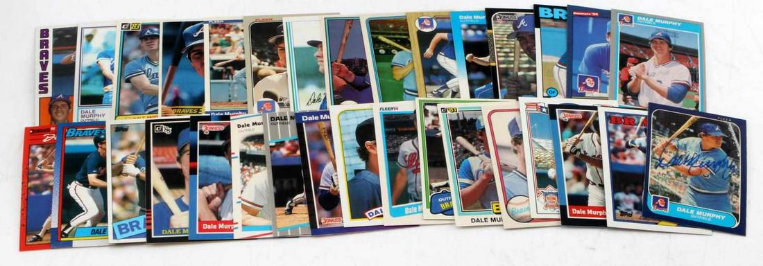 SIGNED DALE MURPHY ATLANTA BRAVES CARD LOT of 31: Signed Dale Murphy Atlanta Braves Card Lot. The Lot contains one signed Dale Murphy card and 30 cards from the early 1980s to the late 1980s. Originally in a plastic sleeve there is no bending, creasi