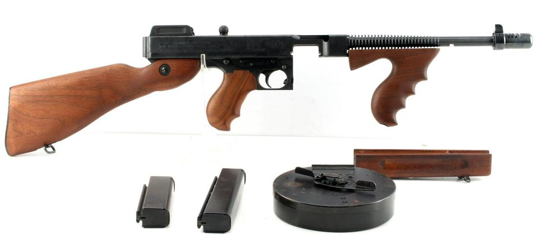 AUTO ORDINANCE CORP 45 AUTO THOMPSON SMG REPLICA: Auto Ordinance Corporation 45 Auto Thompson Sub Machine Gun Non-Firing Replica. Comes with 20, 30 and 50 round magazines. The lot also includes a different foregrip. Magazines, safety, fire mode and t