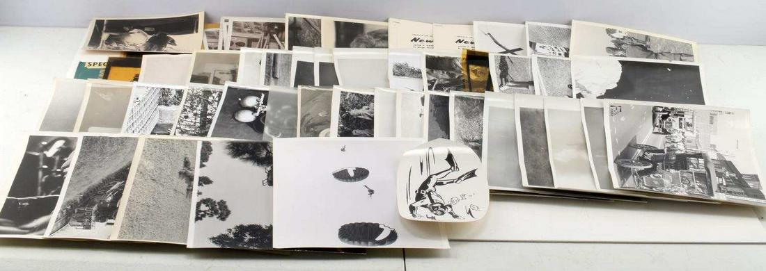 VIETNAM ERA FORT BRAG TRAINING PRESS PHOTOS LOT: Large lot of military training photos and accompanying press release information from Fort Brag. Paratrooper and scuba training. Vietnam era. Some slight bending from storage and signs of age, overall