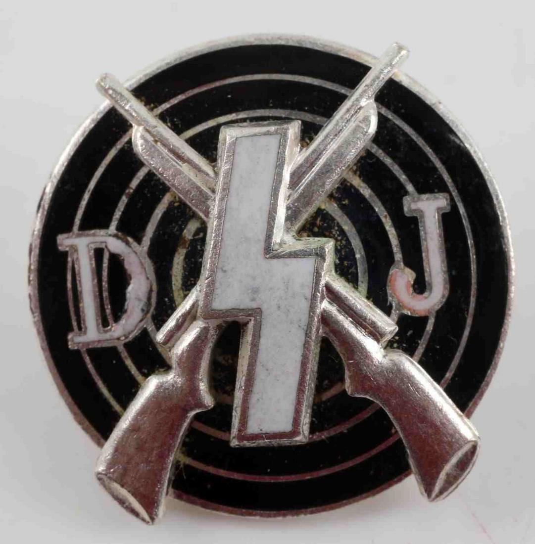 WWII GERMAN THIRD REICH DJ MARKSMAN SHOOTING BADGE: German WWII Deutsches Youth DJ Marksman Shooting Award. Measures 13/16” in diameter. The reverse side is maker marked ‘RZM M1/123’. Has a thin horizontal safety pin back. Two piece nickel constr