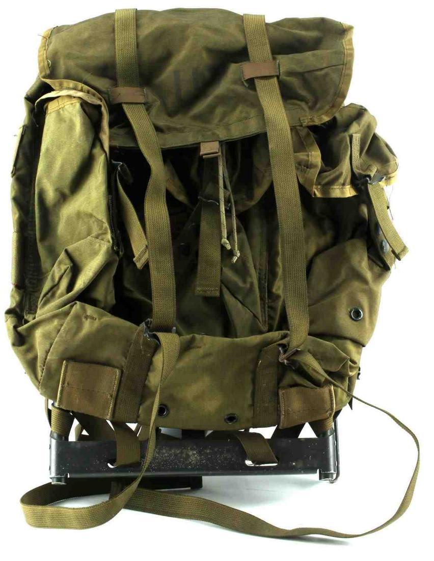 US ARMY MILITARY ISSUE ALICE PACK RUCKSACK: US Army military Issue Alice pack rucksack, Features metal frame and multiple compartments. Bottom of frame has one part loose but does not affect the pack. Measures approximately 22 inches tall and 1