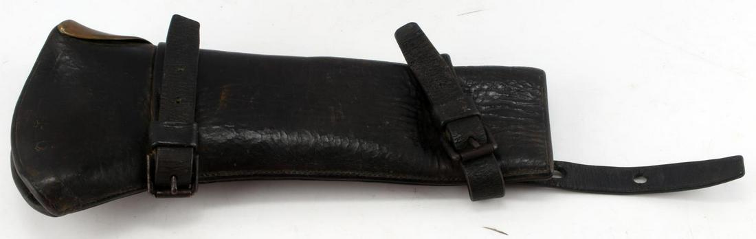 U.S. INDIAN WARS M1887 CAVALRY CARBINE BOOT SCABBARD: Original scabbard by Rock Island Arsenal. Leather construction, with brass bump plate and steel buckles. Measures 13 inches in length. Has "46" embossed on one side. Signs of age and wear, but overall