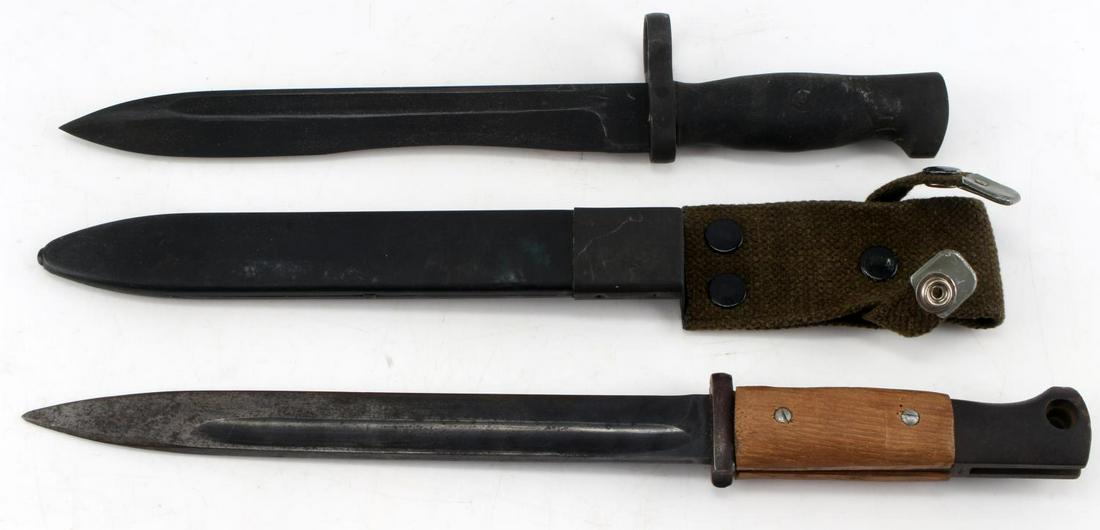WWII GERMAN AND SPANISH BAYONET LOT OF 2: Lot of 2 WWII bayonets, 1 German K98, 1 Spanish. German bayonet features wooden grip, is stamped "Berg and Co" and features faint Waffenampt stamps on spine of handle and near end of pommel. Measures 