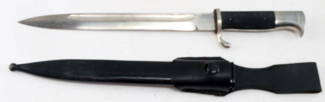 WWII GERMAN K-98 BAYONET WITH SCABBARD AND FROG: Very good dress finish unmarked blade, black leather frog,checkered Bakelite grip. This lot has a reserve.