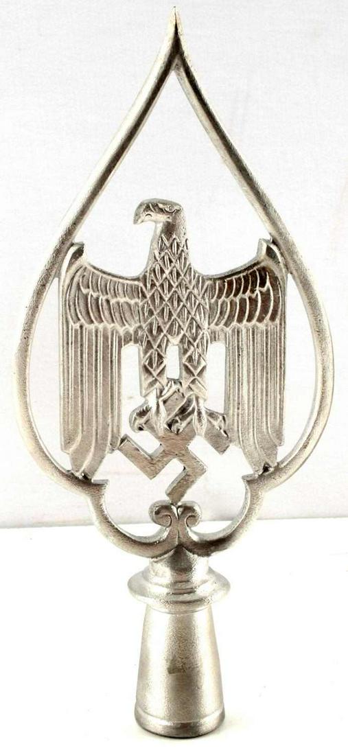 WWII GERMAN THIRD REICH SPADE FLAG POLE TOPPER: WWII German Third Reich spade flag pole topper. Features Eagle and swastika inside of spade. Lightweight metal. No visible age or discoloration. Silver colored finish. Overall, very good condition. Un