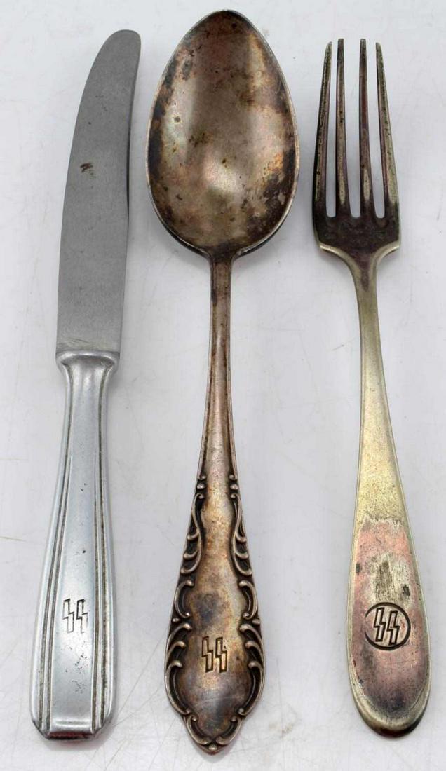 WWII GERMAN 3RD REICH NAZI SS SILVERWARE SET: WWII German Third Reich SS Silverware set. Includes One knife, spoon, and fork. Spoon and fork are highly oxidized/discolored and feature the SS runes on the handle as well as ornate markings. The kni