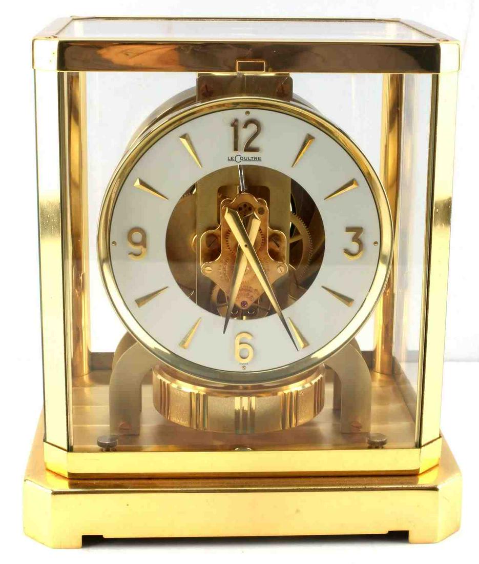 JAEGER LECOULTRE ATMOS BRASS MANTLE CLOCK: Jaeger LeCoultre Company Atmos model brass mantle clock. Features glass and brass construction. Measures approximately 9.50 in by 8.50 in by 7in. Good condition, no key.