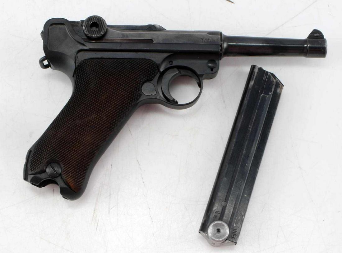 WWII GERMAN MAUSER LUGER SEMI PISTOL 9MM 1940: Blued steel, checkered wood grips, 4 inch barrel with bright clean bore, 1940 and 42 marked to top of frame, 57 marked throughout, s/n 9357 marked to front and left side of frame and underside barrel,