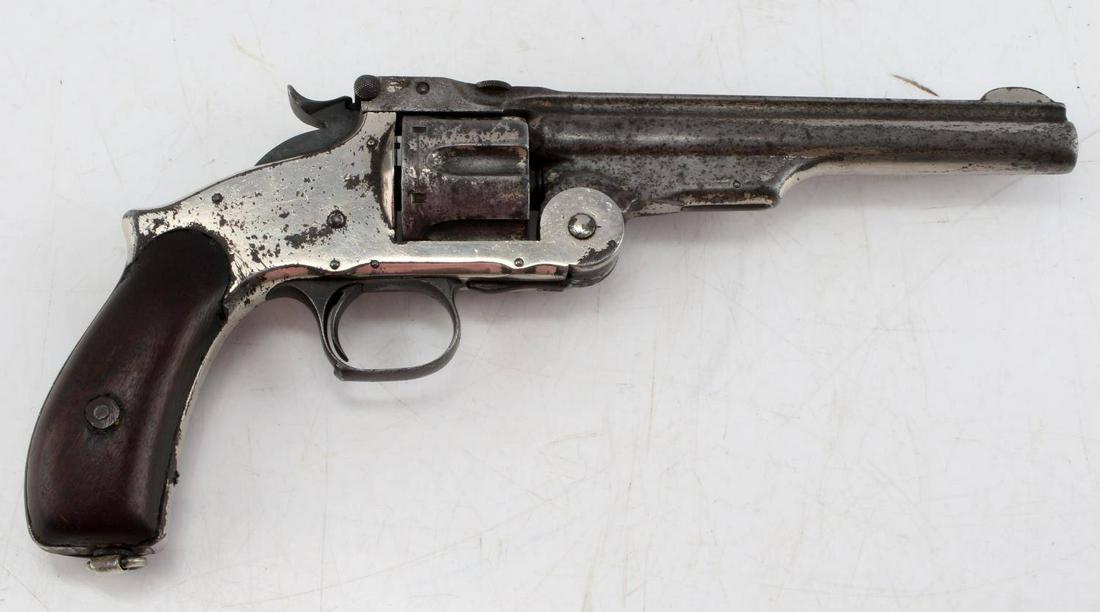 ANTIQUE SMITH & WESSON .44 CAL RUSSIAN MODEL 3: Smith and Wesson .44 caliber Russian model 3 revolver. Holds 6 rounds. Barrel measures 6.50 inches long. Handle features hardwood grips. Revolver has some pitting on barrel, receiver, and bore. Cylnde