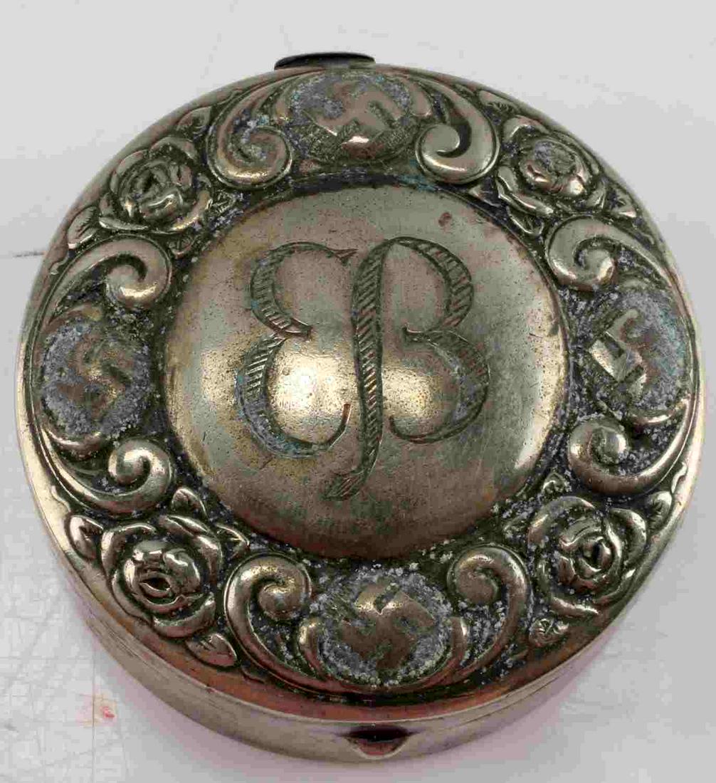 WWII GERMAN EVA BRAUN SILVER ROUND PILL BOX: WWII German Eva Braun Silver Round Pill Box. The item was recovered from a 101st Airborne Paratrooper from the Berghof. Her initials are centrally engraved with a ornate design around the outer rim. M