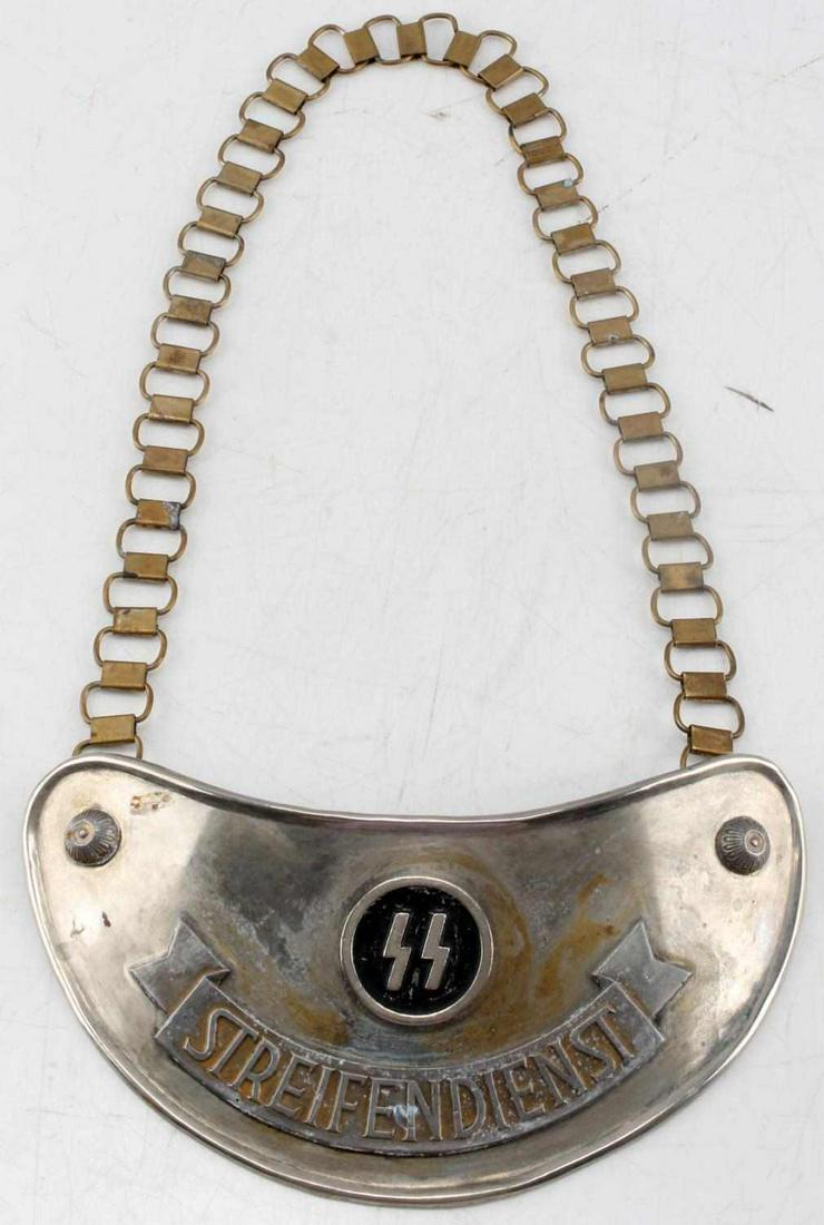 WWII GERMAN THIRD REICH SS PATROL GORGET & CHAIN: WWII German Third Reich SS gorget. Has "Streifendienst" and SS runes on front. Back tabs are marked "SS 348" "SS' "ABT SUD." Measures 8.50 in by 4 in. Includes 24 in chain. Good condition.