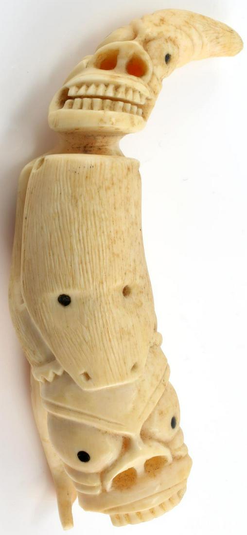 TUPILAK GREENLANDIC INUIT WHALE TOOTH SCRIMSHAW: Early example, damage to lower jaw and left foot, superbly crafted measures following the curve 7 inches. Over 100 years old we will not ship international and please know your state regulations prior