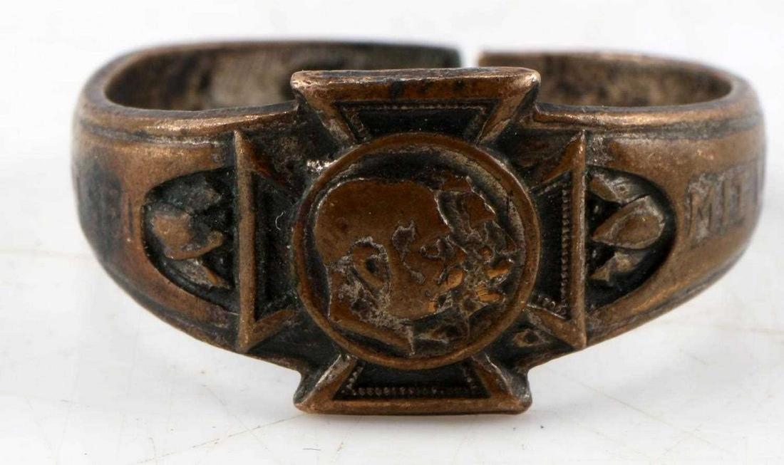 WWI GERMAN MILITRAY RING WITH IRON CROSS MOTIF: WWI era German military ring. Features phrase "Gott Sei Mit Uns," with iron cross and portraits on main face. Band has been cut in the past. Overall far condition. Shank is snapped so not sized.