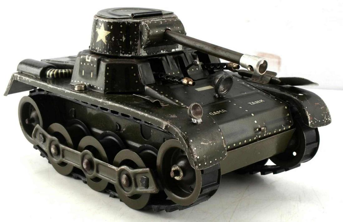 VINTAGE GERMAN TIN TOY CLOCKWORK GAMA TANK: Vintage West German made tin and litho printed toy tank. Gama brand tank, no key, however gears and wheels still turn. Measures 4.50 inches tall, 7.50 inches long, and 4.25 inches wide. Shows signs of