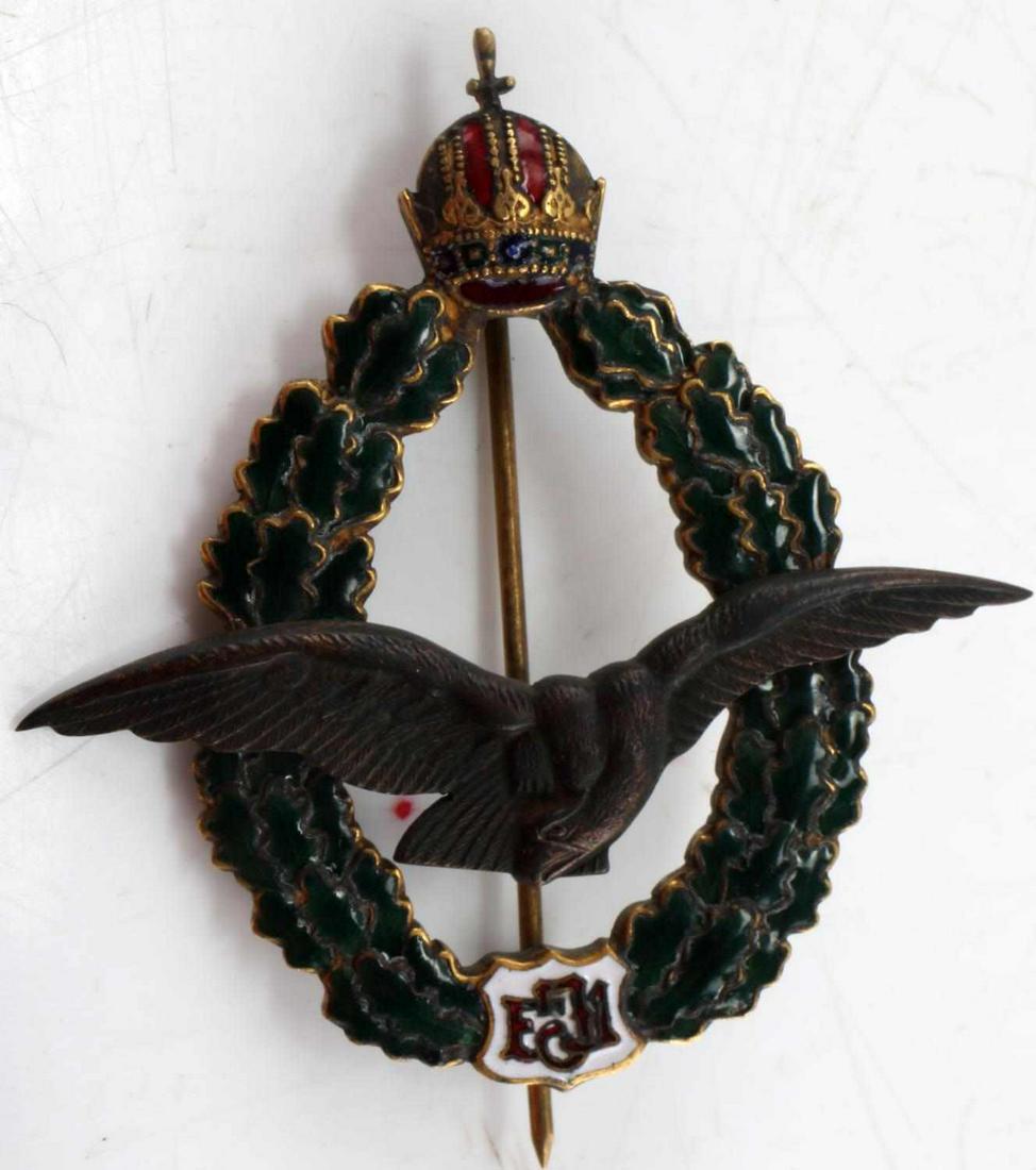 WWI AUSTRIAN FIELD PILOT BADGE ZIMBLER WIEN: WWI Austrian Field Pilot Badge Zimbler Wien. Makers mark of "J. Zimbler Wien VII". Nice enamel front. Wingspan measures 2.25 inches, measures 2.5 inches overall. Has the Franz Joseph cypher. Some pati