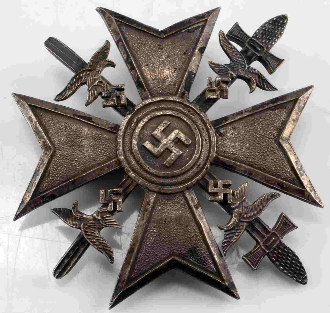 WWII GERMAN 3RD REICH SPANISH CONDOR CROSS SWORDS: German WWII Condor Legion Silver Spanish Cross With Swords. The front shows a swastika in the center of a Maltese cross. There is a Luftwaffe flying eagle clutching a swastika in his talons in each co