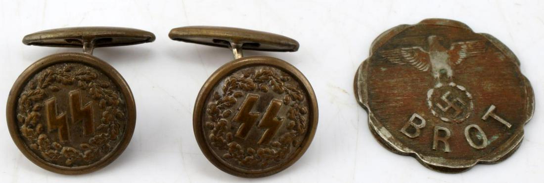 WWII GERMAN THIRD REICH BUTTONS AND TOKEN LOT OF 3: Lot of 2 WWII German Third Reich SS buttons, 1 "Brot" token. Buttons measure .75 inches in diameter and coin is 1 inch in diameter.