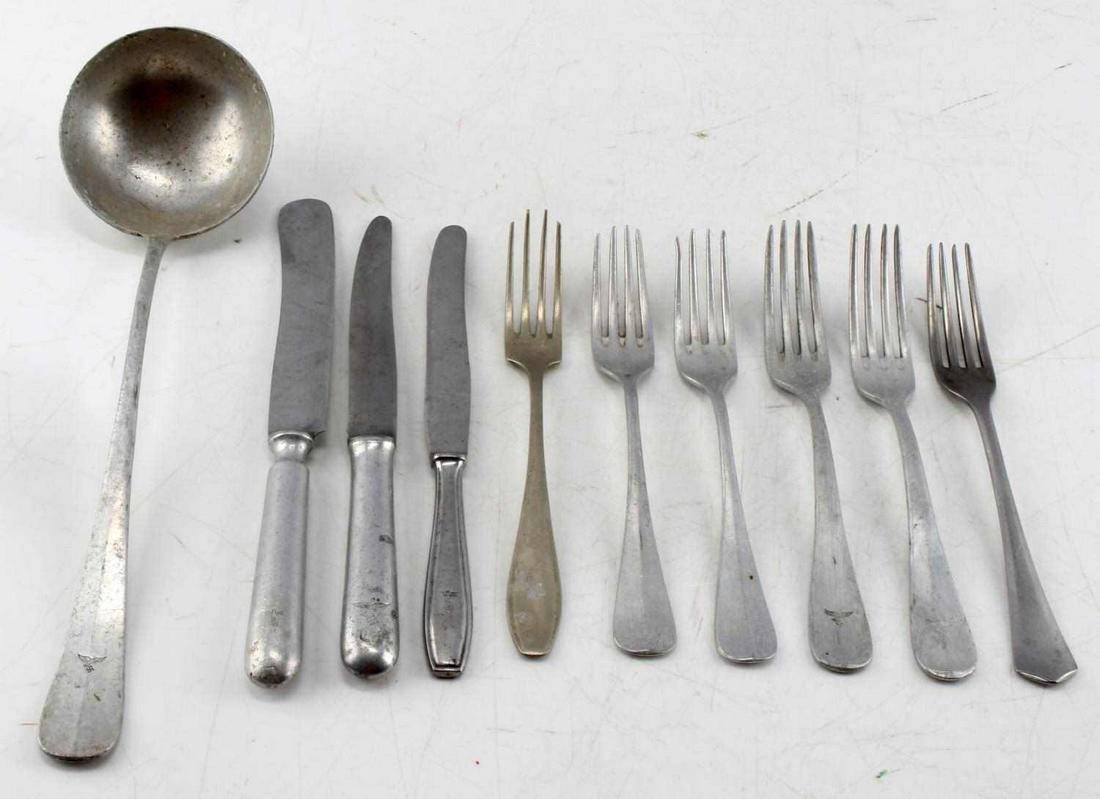 WWII THIRD REICH GERMAN SILVERWARE 10 PIECES: Lot includes: one 13 inch ladle, 6 forks and 3 knives. Different makers, all pieces marked somehow. Made from aluminum with a couple from other metal. Fair to good condition.