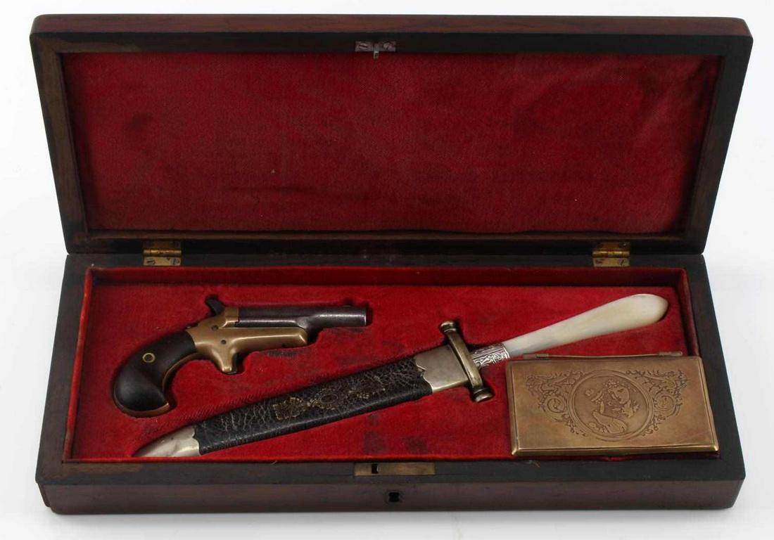 1800'S SUFFRAGETTE COLT DERRINGER & DAGGER NAMED: Set of Derringer, dagger and trinket box made in 19th century for suffragette named Mary Taylor. The set comes in a wooden box engraved "Mary Taylor" on top, and comes with an archive describing Mary 