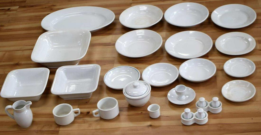 WWII THIRD REICH GERMAN PORCELAIN DINNERWARE: Over 20 pieces including: 2 salt and pepper shakers, each in reservoir, 2 mugs, 4.5 inch creamer, egg dish (cracked), 1.75 inch creamer, small 4.5 inch tureen with lid, 16 inch platter, 2 8.5 inch squ