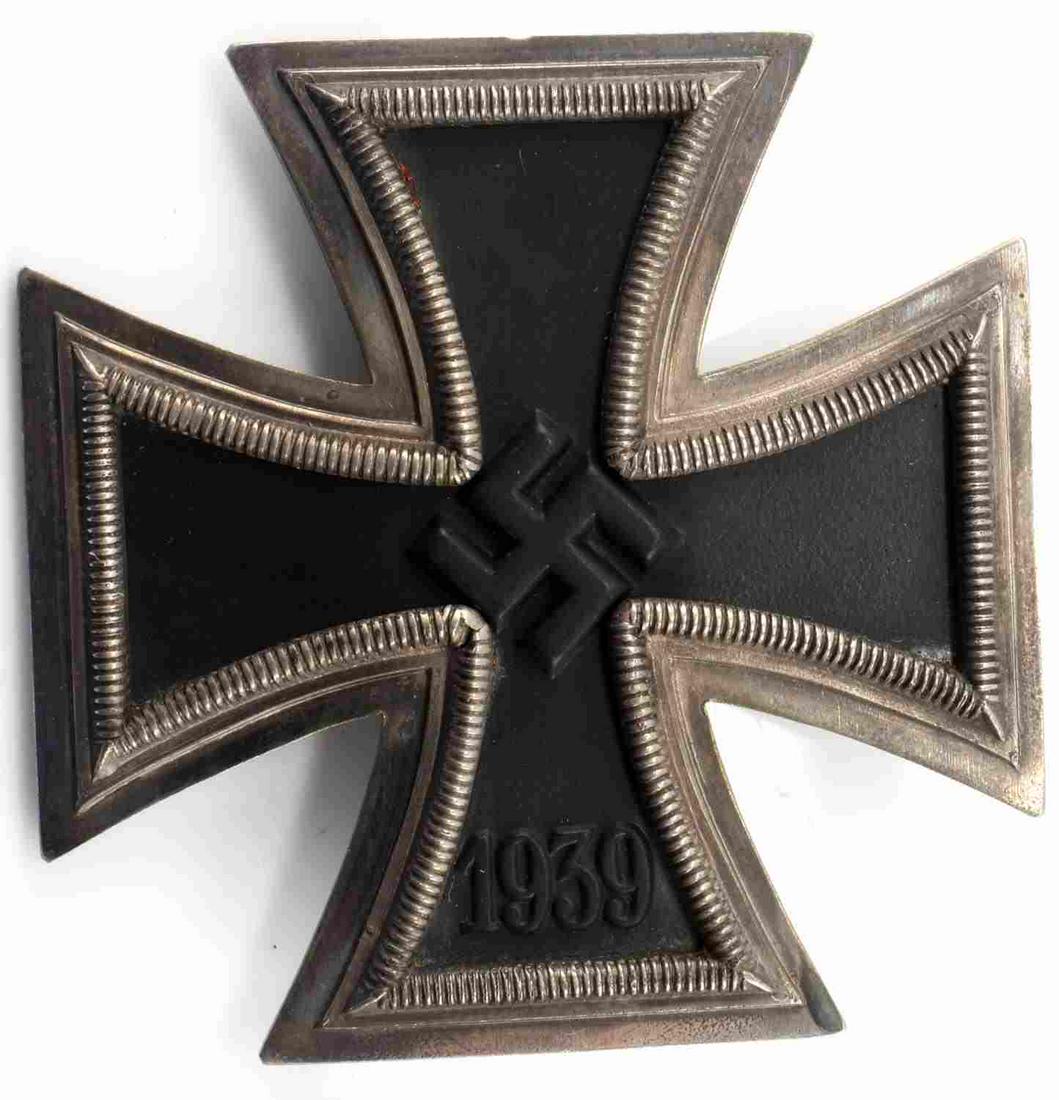 WWII GERMAN 1939 IRON CROSS 1ST CLASS BADGE: WWII German 1939 Iron Cross 1st Class. 3 piece construction with real silver frames and magnetic center. Wide pin is marked 1 with 800 stamped below the bottom hook. In good condition. This lot has a 