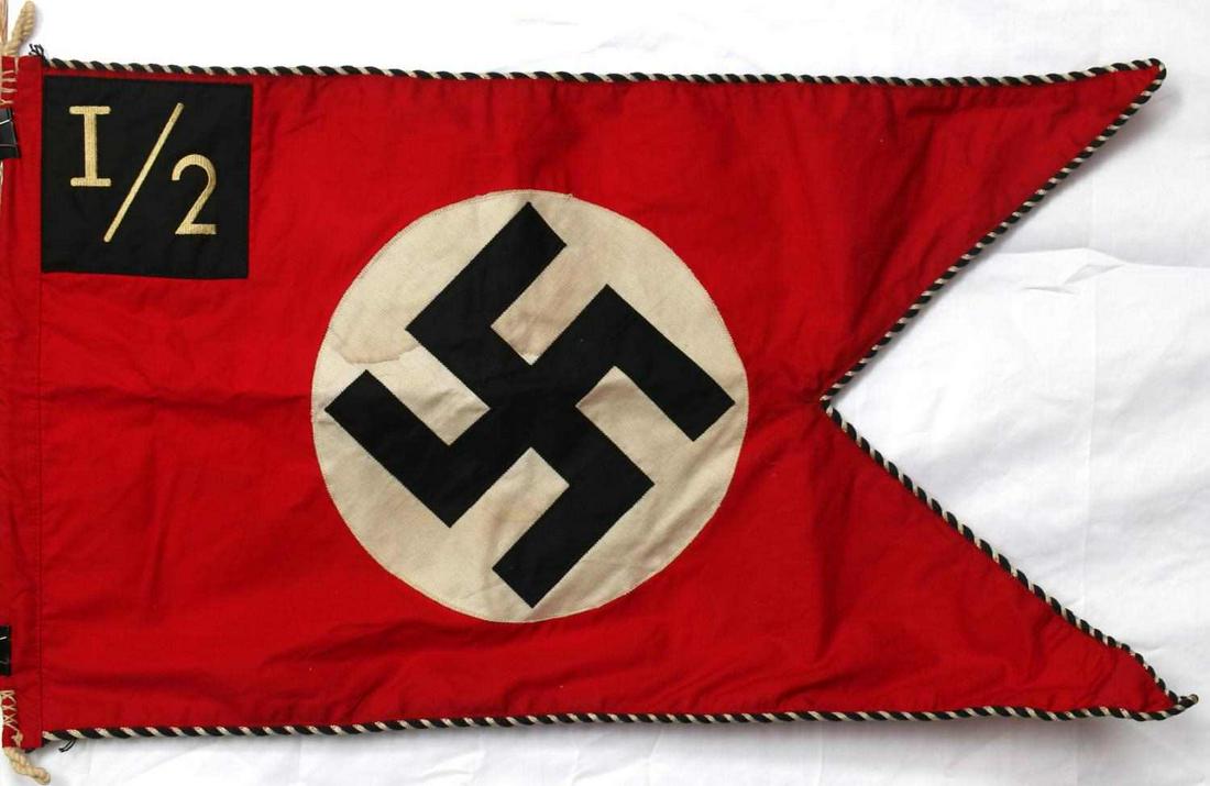 WWII GERMAN SS PENNANT FLAG WITH UNIT CORNER PATCH: WWII German SS early pennant flag with unit corner patch. Measures approximately 29" by 18". Alternating black and white piping around 3 sides for SS. Shows wear and fading but no damage. In good cond