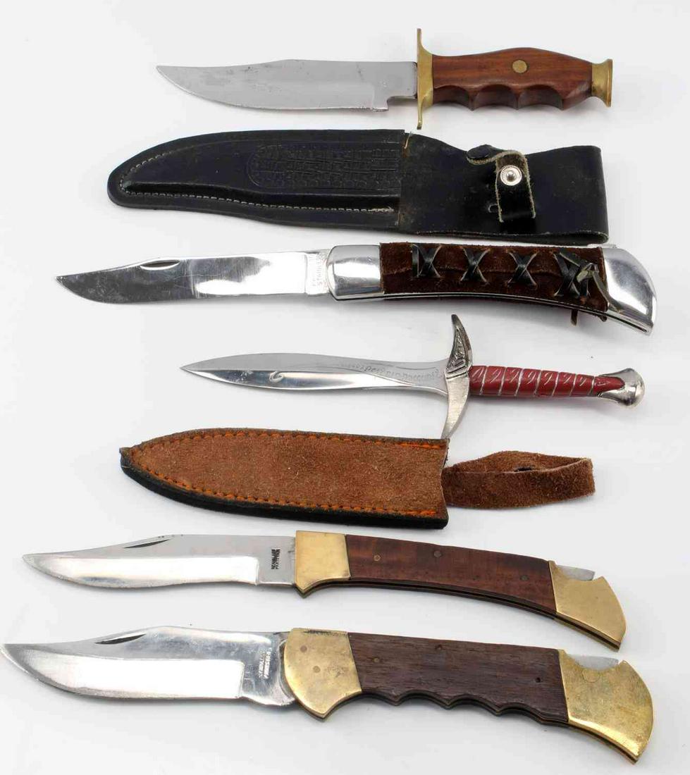 MISC PAKISTAN KNIFE LOT FOLDING AND FIXED BLADE: Lot includes 5 assorted stainless steel knives from Pakistan. Two fixed blade knives come with leather sheaths, the 5" blade has engravings on it, minor use wear. The 6" fixed blade has minor oxidatio