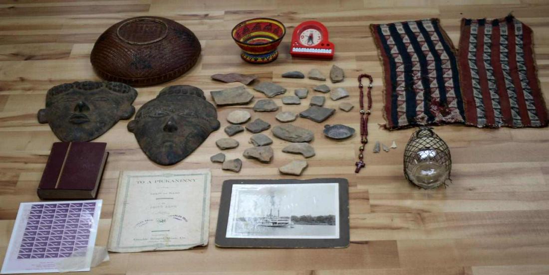 GENERAL ANTIQUE ARTIFACT COLLECTIBLE LOT: To include partially Heinz Ketchup clock, Florida native American pottery shards and arrowheads, Basketry, sheet music, photo copy of original 7 astronauts signatures, pre Columbian textile vest, styl