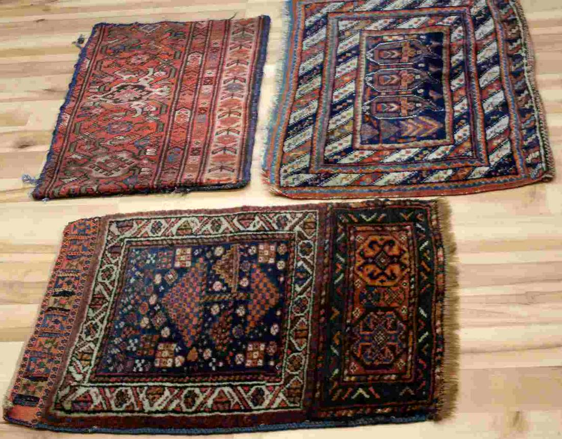 ASSORTED PARTIAL PIECES OF ANTIQUE PERSIAN WEAVES: Two partials appear to be excerpts of antique Persian wool wall hangings and retain button or loop holes along one edge (27x22 inches, 30x20 inches) one retains patches of adhesive. The third was made