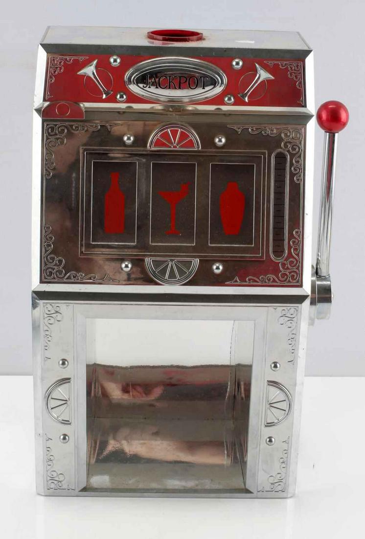 JACKPOT SLOT MACHINE LIQUOR DISPENSER GODINGER ART: Jackpot Silver Slot Machine Liquor Dispenser. Measures 13 inches x 10 inches. Slot lever is functional. Missing the red cap on top, but this piece remains in very good conditon. Comes with an instruct