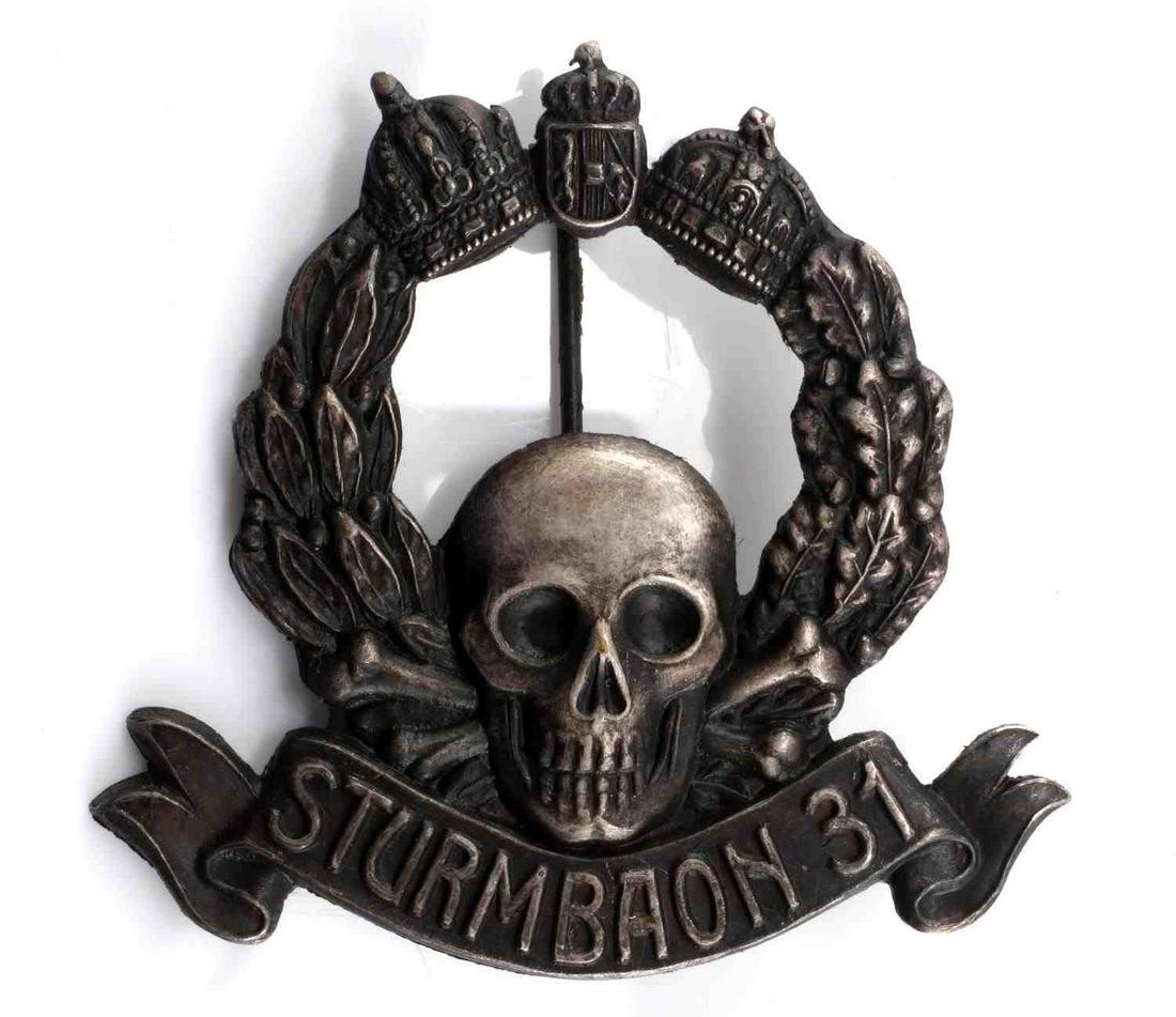 WWI AUSTRIAN MONARCHY STORM TROOPER BADGE: WWI Austrian Monarchy Storm Trooper Badge. Made for the troops of Sturmbaon 31. Scooped back with vertical pin back. Makers mark on skull in the rear. Very good condition. Measures about 1.5". This lo