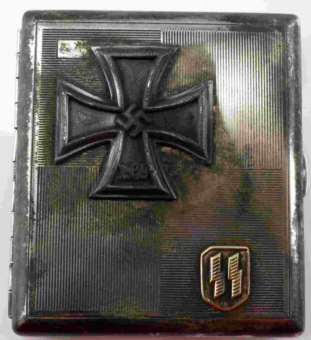 WWII GERMAN 3RD REICH IRON CROSS SS CIGARETTE CASE: WWII German Third Reich Iron Cross winner's SS cigarette case. Measures 3.75x3.25 inches. Surface features slight oxidation and patina. Levers inside the case feature makers mark RZM and SS logo. Meta