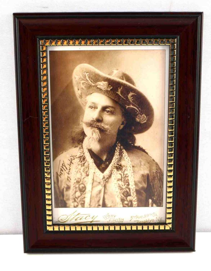 OLD WEST BUFFALO BILL PHOTO POST CARD: The frame measures 5 9/16” wide by 7 9/16” tall. The picture shows William F. “Buffalo Bill” Cody dress in his western garb and cowboy hat The photographer’s name on the base reads ‘Stacy 