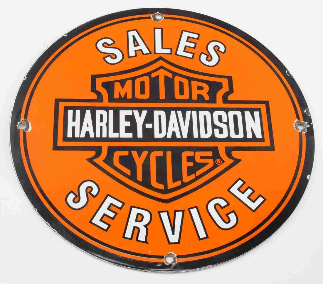 VINTAGE HARLEY DAVIDSON MOTORCYCLE SALES SIGN: Harley Davidson Motorcycle Sales Service Porcelain on tin Sign. The sign measures 11.75 inches in diameter and has four hanging holes. There is patina around the hanging holes. The sign is in very goo