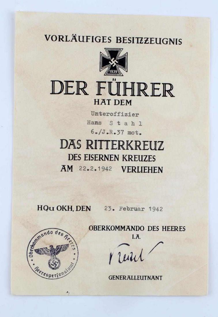 GERMAN WWII KNIGHTS CROSS IRON CROSS DOCUMENT: Measures 5 1/2" wide by 7 13/16” tall. This is the preliminary document awarded to ‘Unteroffizier Hans Stahl 6./J.R.37 mot.’. It was awarded on ’23. Februar 1942’. It shows a rendition of th