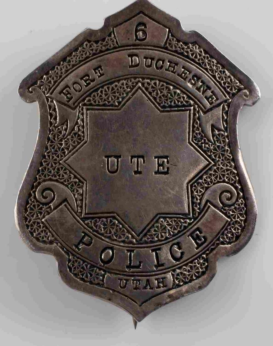 OLD WEST UTE FORT DUCHESNE POLICE UTAH LAW BADGE: Old West UTE Fort Duchesne Utah # 6 Police Law Badge – Coin Silver. Measures 1 7/8” wide by 2 1/2" tall. The front reads ‘UTE Fort Duchesne Utah # 6 Police’. The reverse side is marked ‘Coin