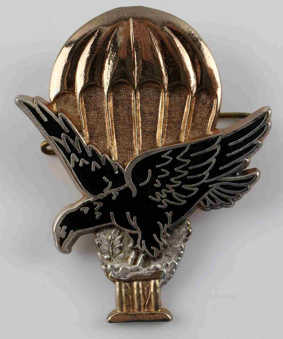 WWII FRENCH AIRBORNE PARATROOPER JUMP BADGE: WWII French Airborne Paratrooper Jump Badge by Drago Paris. Measures 1 7/8” wide by 2 3/8” tall. The front shows a flying eagle clutching ‘III’ in his talons. There is a parachute in the back 