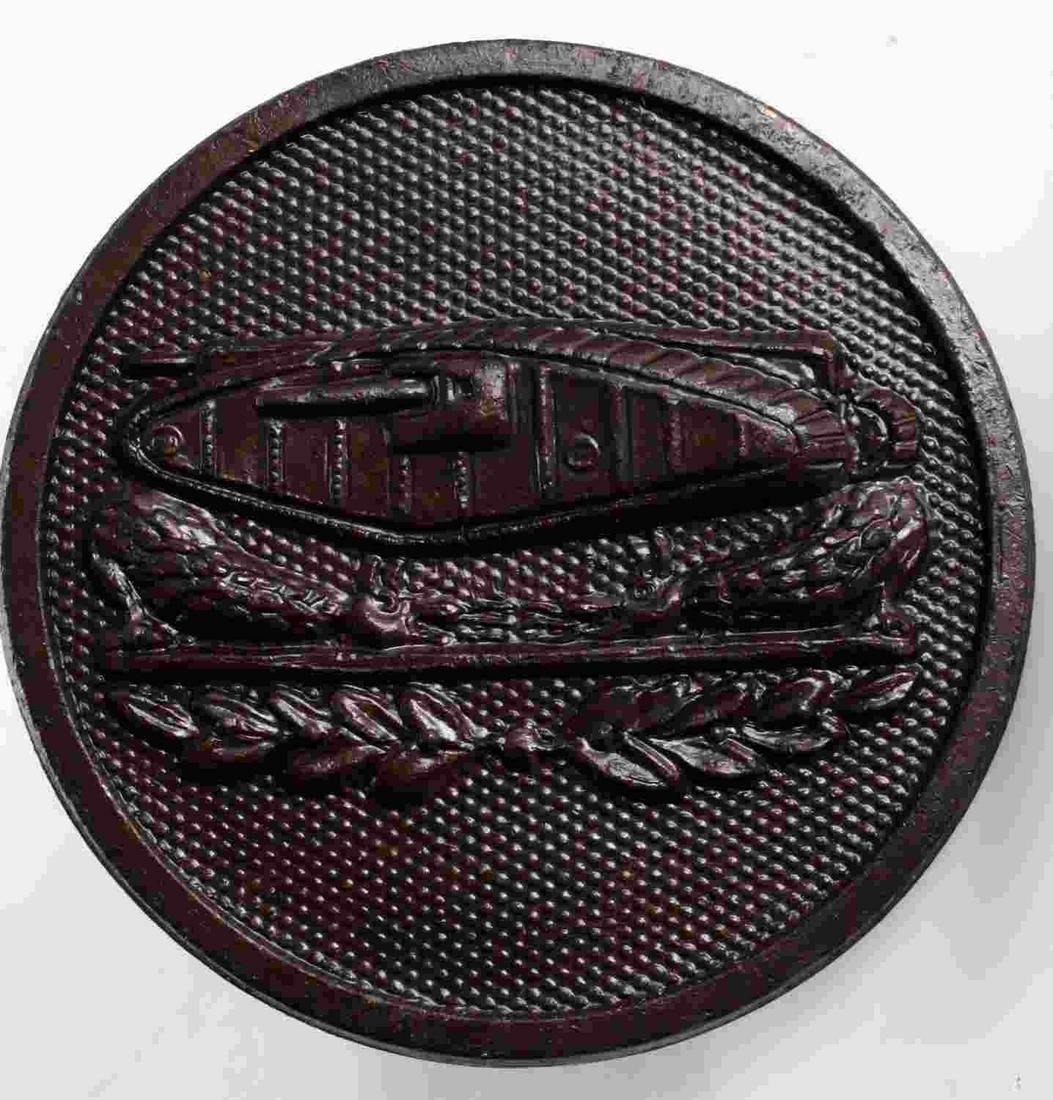 US WWI ARMY AEF TANK ENLISTED MANS COLLAR DISC: Measures 1” in diameter. The front shows the profile of a tank with two dragons below in the center. The reverse side is maker marked ‘NS Meyer Inc New York’. Has a screw mount post and brass nu