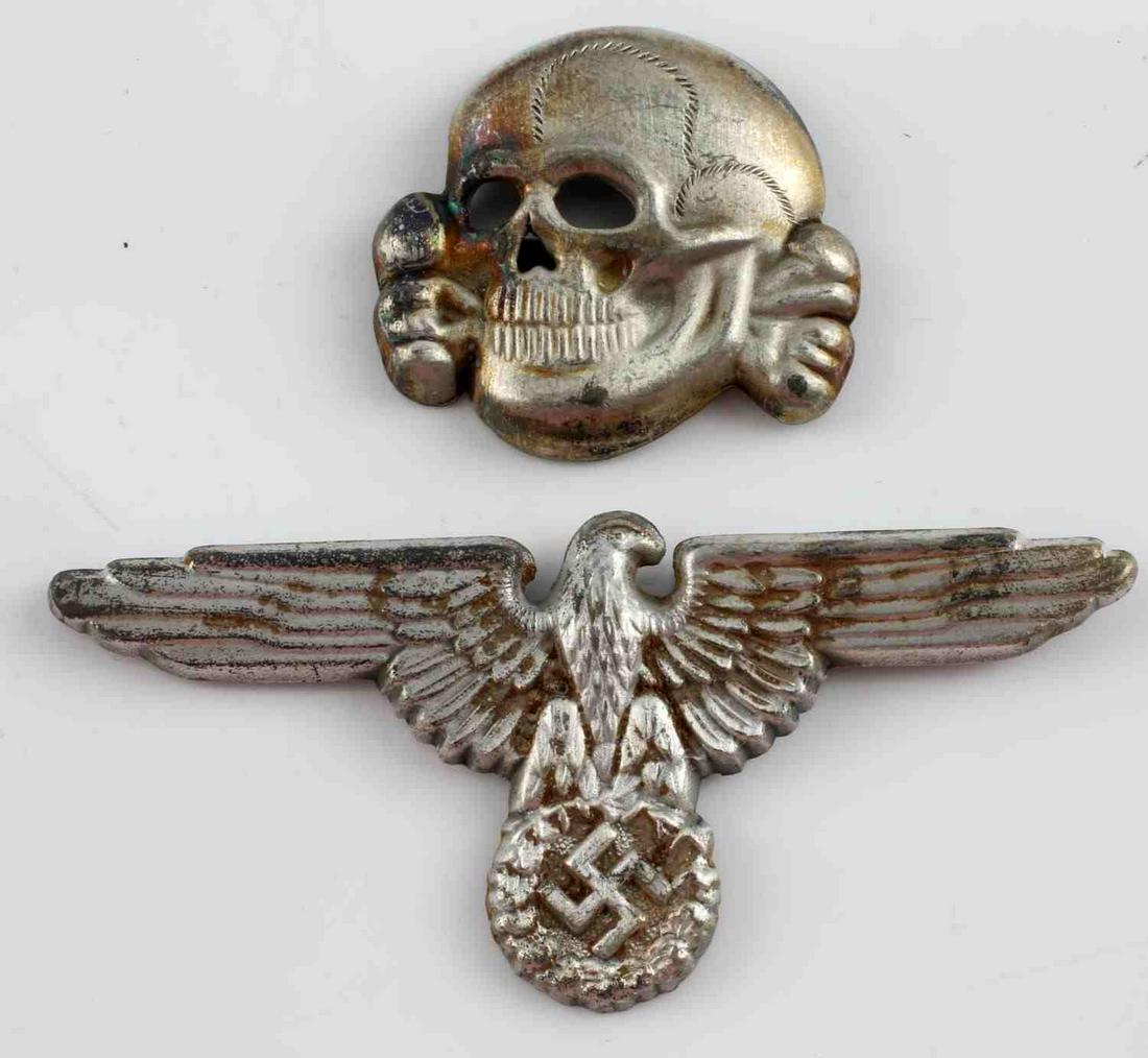 WWII GERMAN SS OFFICERS VISOR CAP EAGLE & SKULL: German WWII Waffen SS Officers Visor Cap Eagle & Skull. The Waffen SS eagle is clutching a swastika in his talons. The skull and cross bones is the version with the jaw. Both are maker marked ‘RZM M