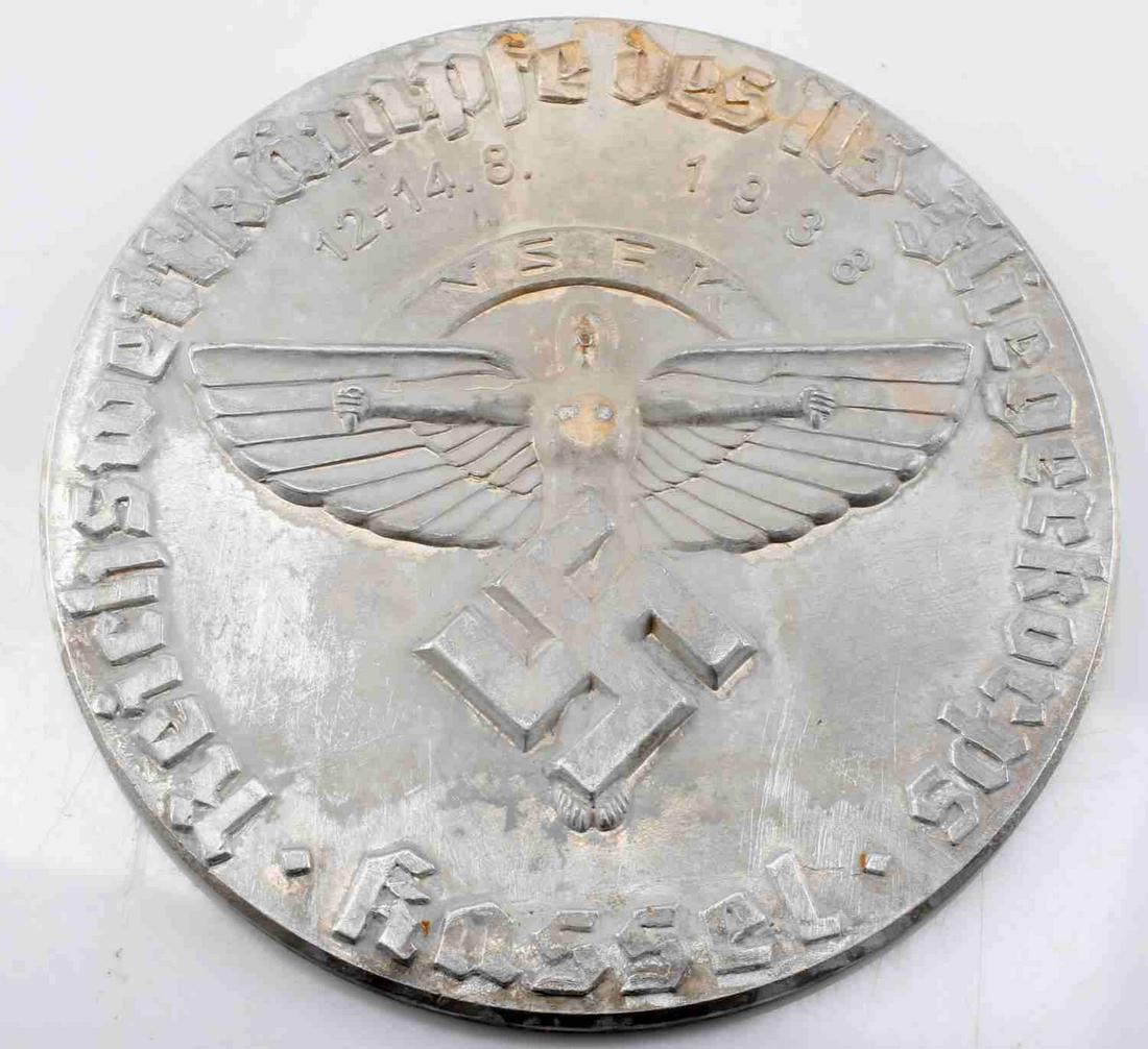 WWII GERMAN 1938 NSFK GLIDER KORPS TABLE MEDALLION: Front reads "Reichswettkampfe des NS-Floegerkorps Kassel 12.14.8 1938 NSFK". Shows the Icarus winged man in the center with a swastika below. Mild discoloration at top of medallion, and mild oxidation