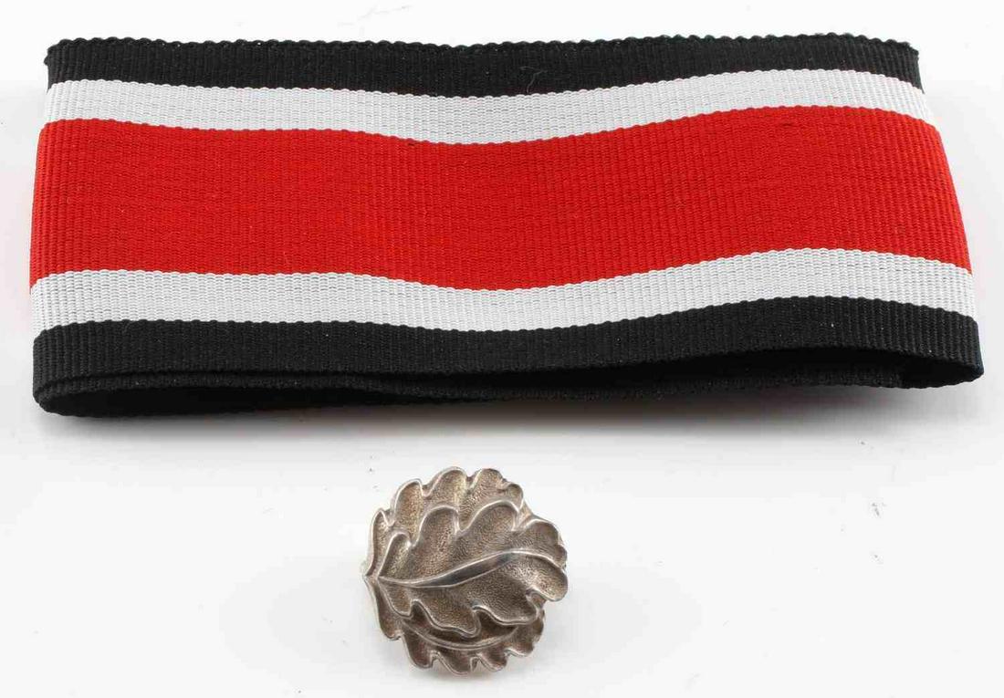 WWII GERMAN THIRD REICH KNIGHTS CROSS OAK LEAF: Measures 13/16” wide by 13/16” tall. The front shows two oak leaves. The reverse side is maker ‘800 Silber’ signifying the silver content. There is also an oblong vertical loop on the back for