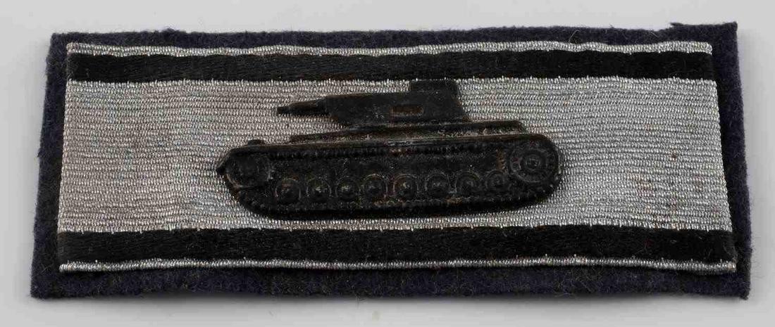 WWII GERMAN ARMY HEER SILVER TANK SLEEVE STRIP: WWII German Army Heer Silver Tank Destruction Armored Sleeve Strip. The dimensions are 3 1/2” wide by 1 3/8” tall. The front shows the profile a Soviet Russian T-34 Tank. It is mounted in the cent