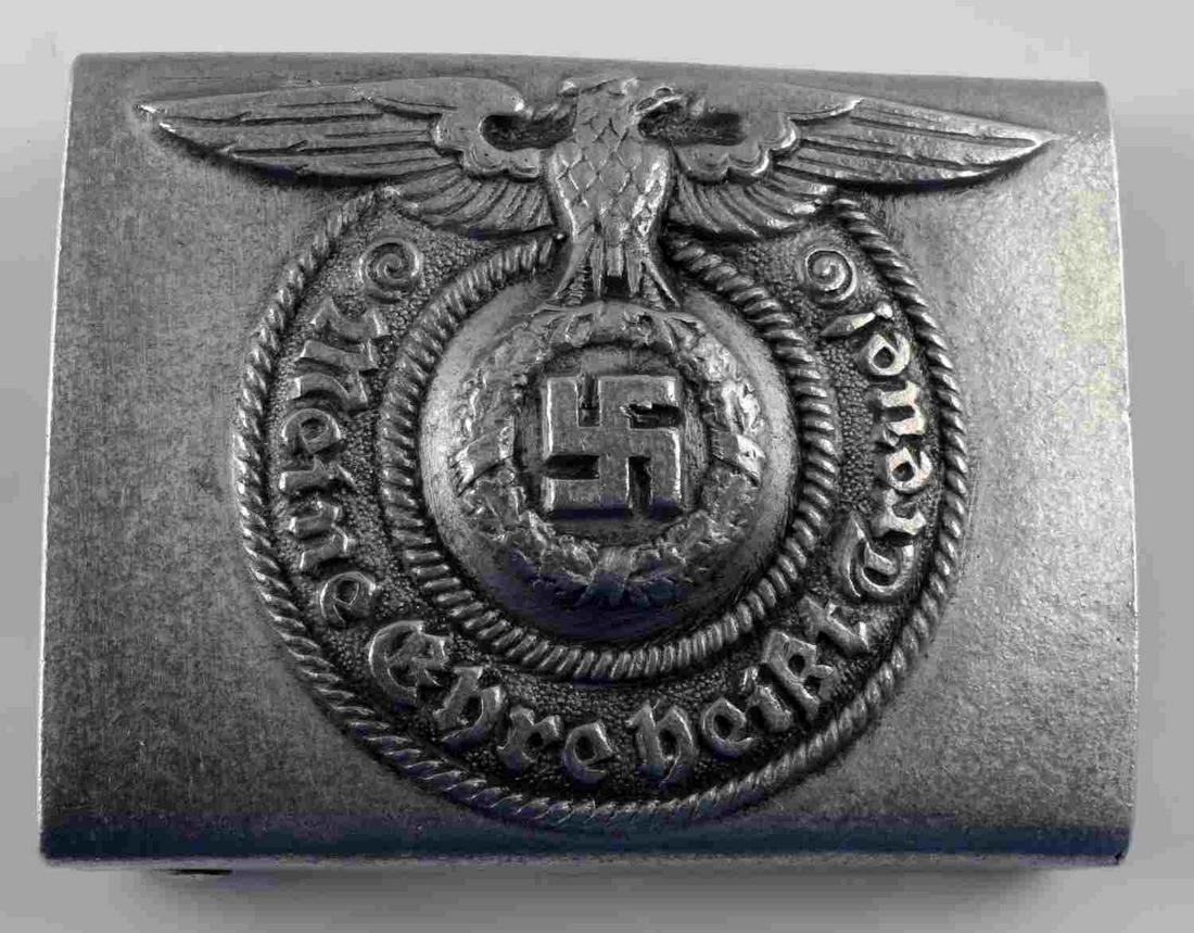 WWII GERMAN THIRD REICH SS ENLISTED BELT BUCKLE: WWII German third reich ss enlisted man's belt buckle measuring 2 1/2 inches wide by 1 3/4 inches tall. Reverse side is marked "RZM" and "822/38" along with two "ss" runes. Includes two prongs on back