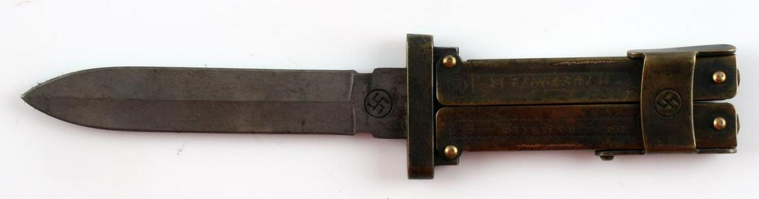 WWII GERMAN WAFFEN SS BUTTERFLY COMBAT BOOT KNIFE: WWII German Waffen SS Butterfly Combat Boot Knife. Measures 7 13/16” long overall with the blade open. Measures 1 9/16” wide by 5 3/4" long closed. The front is maker marked ‘RZM M7/66/347 SS SS