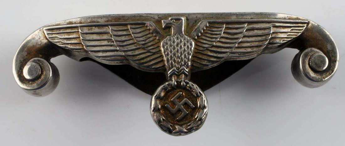 WII GERMAN ARMY OFFICERS DAGGER CROSS GUARD: WWII German Army Officers Dagger Cross Guard. Measures 2 11/16” wide by 1” tall. The front shows a German Army eagle clutching a swastika in his talons. An excellent restoration piece for your dag