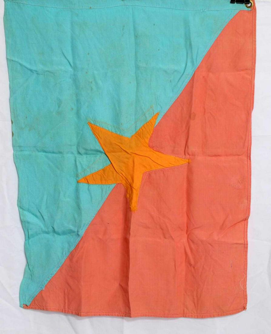 VIETNAM ERA VIET CONG VC COMBAT BATTLE FLAG: Vietnam Era Viet Cong VC Combat Battle Flag. Measures 21" wide by 16 1/2" tall. Has a five armed cloth yellow star in the center on both sides. Double sided. There are two brass grommets on one end. F